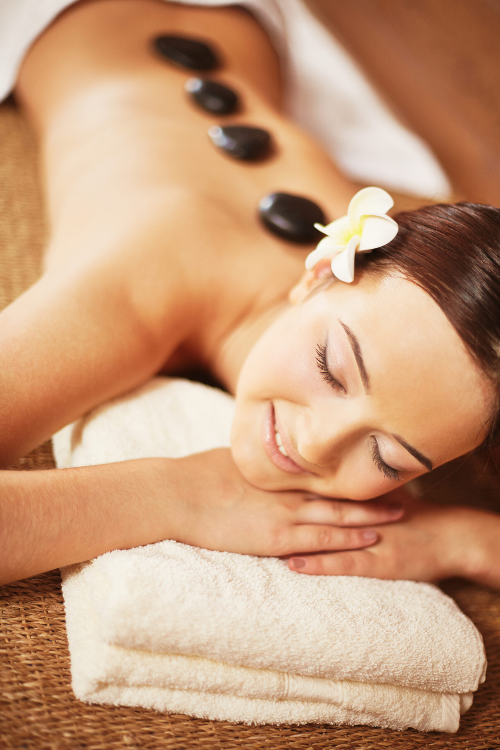 Portrait of young female enjoying spa procedure in beauty salon